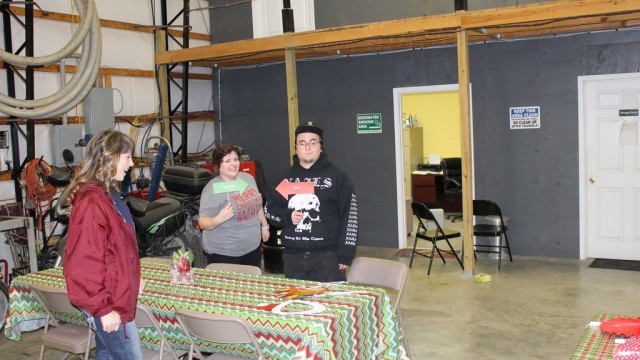 Alyx, Tyler, and Shannon setting up tables
